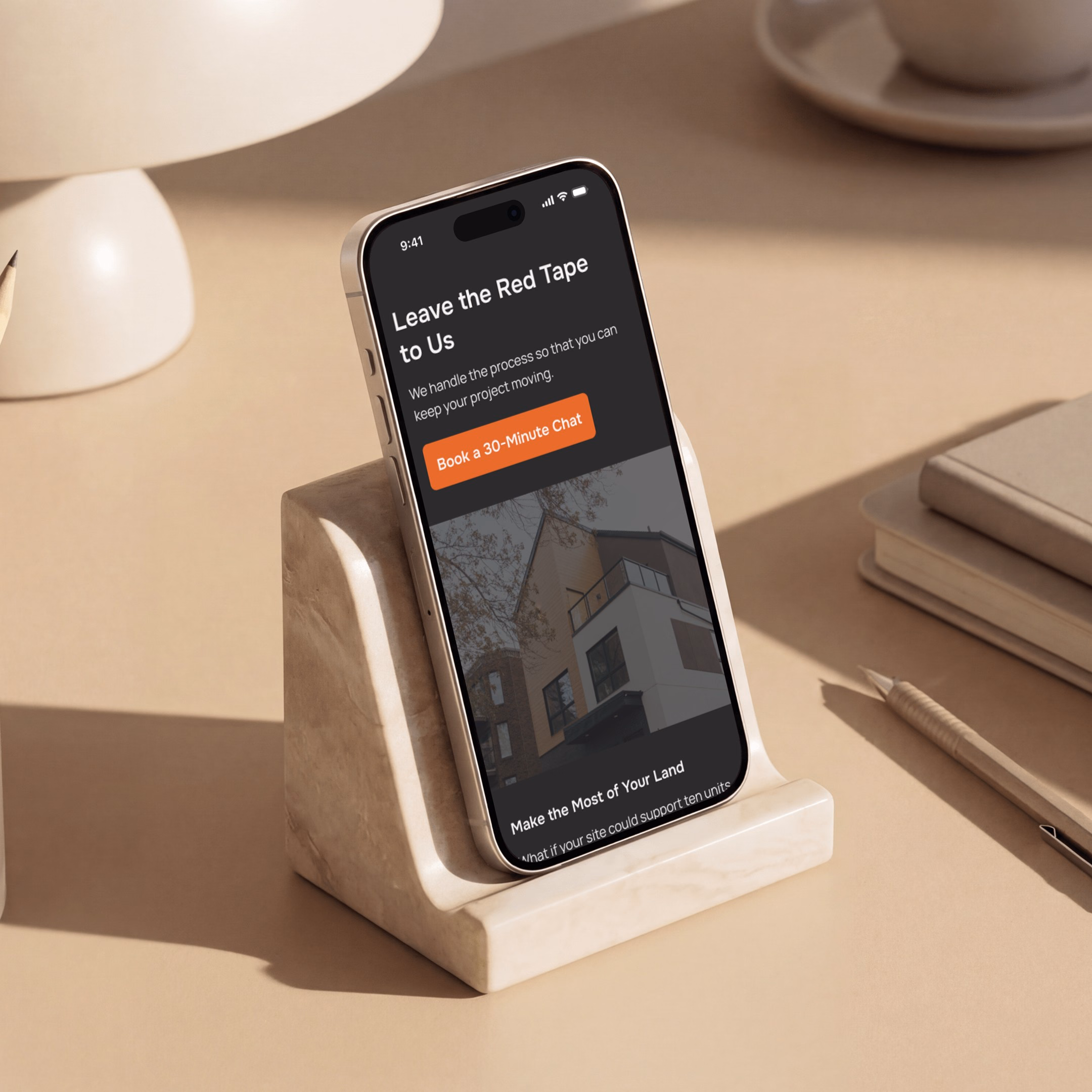 Real estate website mockup on a smartphone stand