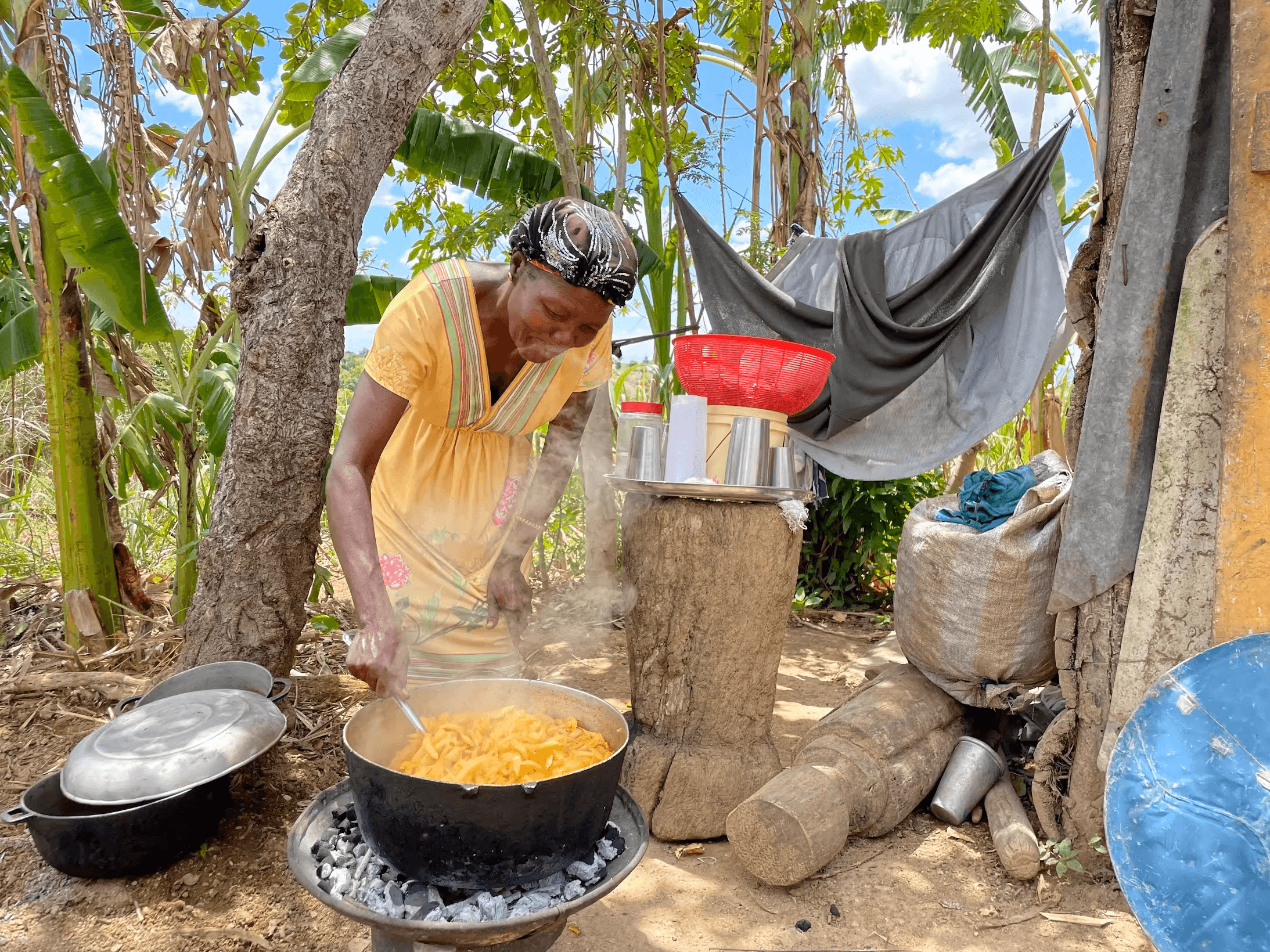 Hungry For Life community member cooking a meal outdoors